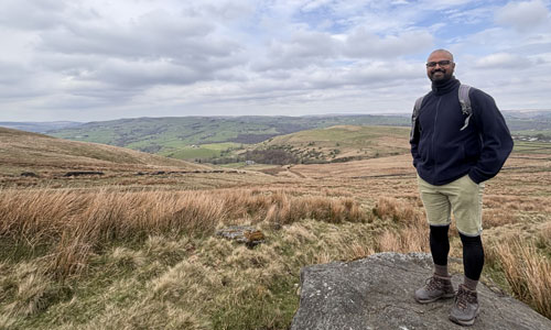 Arya Gupta standing in front of moorland