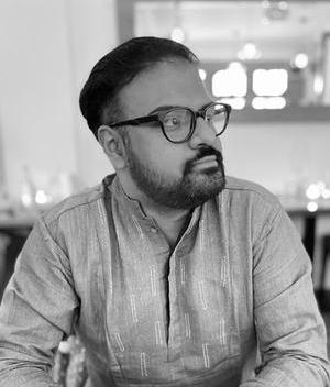 Black and white headshot of Arya Gupta