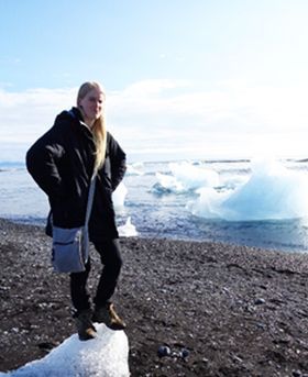 Laura Glendinning standing on a beach.