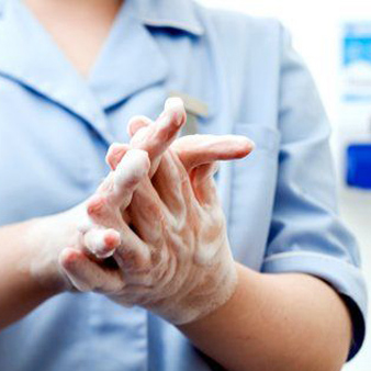 Soapy hands being washed