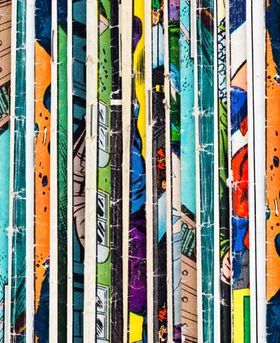 A mix of colourful comic books stacked vertically.