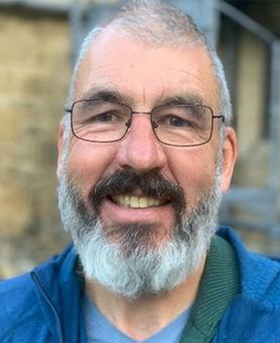 Headshot of Greggory.