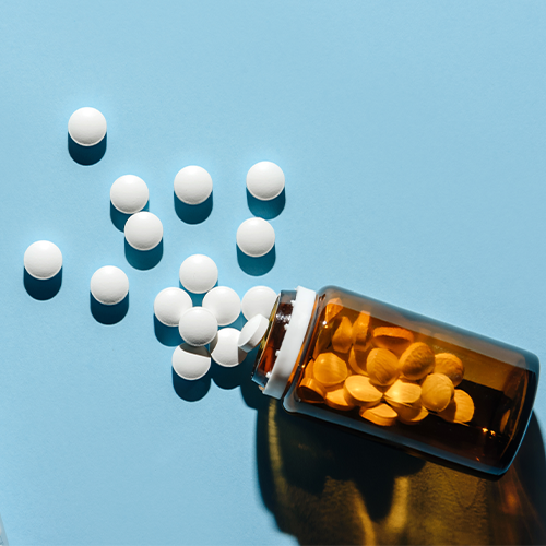 Bottle of white pills.